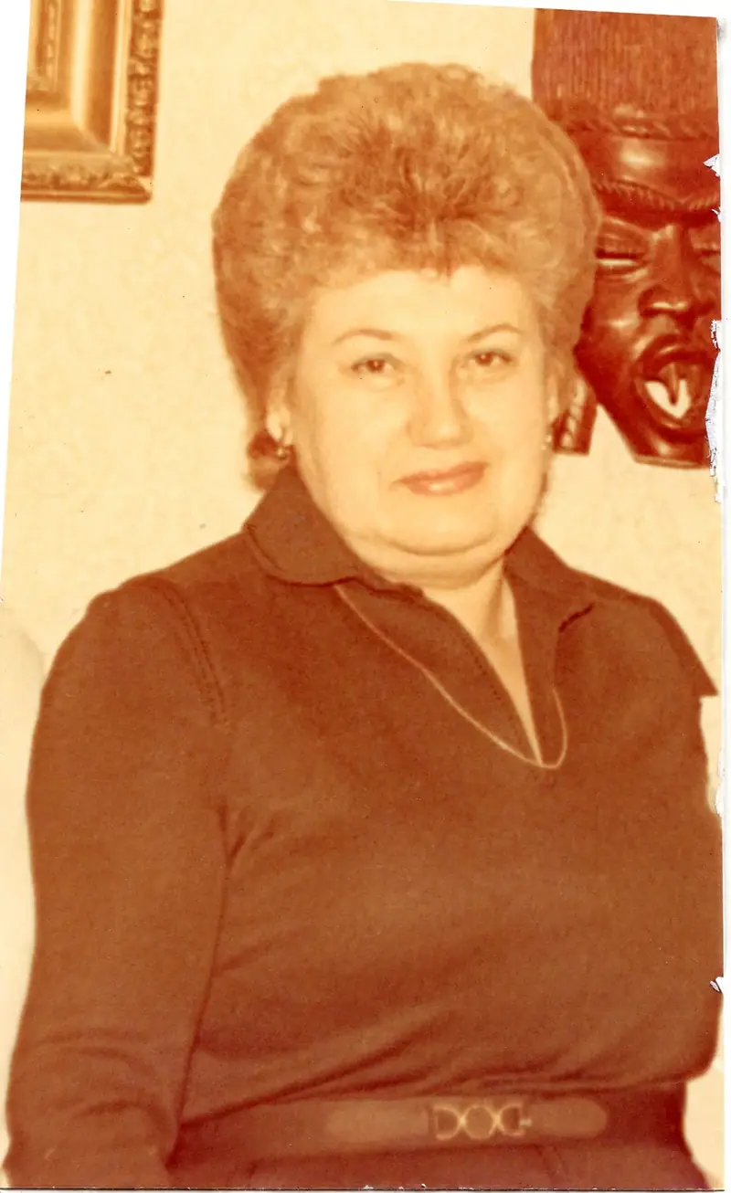 Old damaged photograph of a woman before restoration